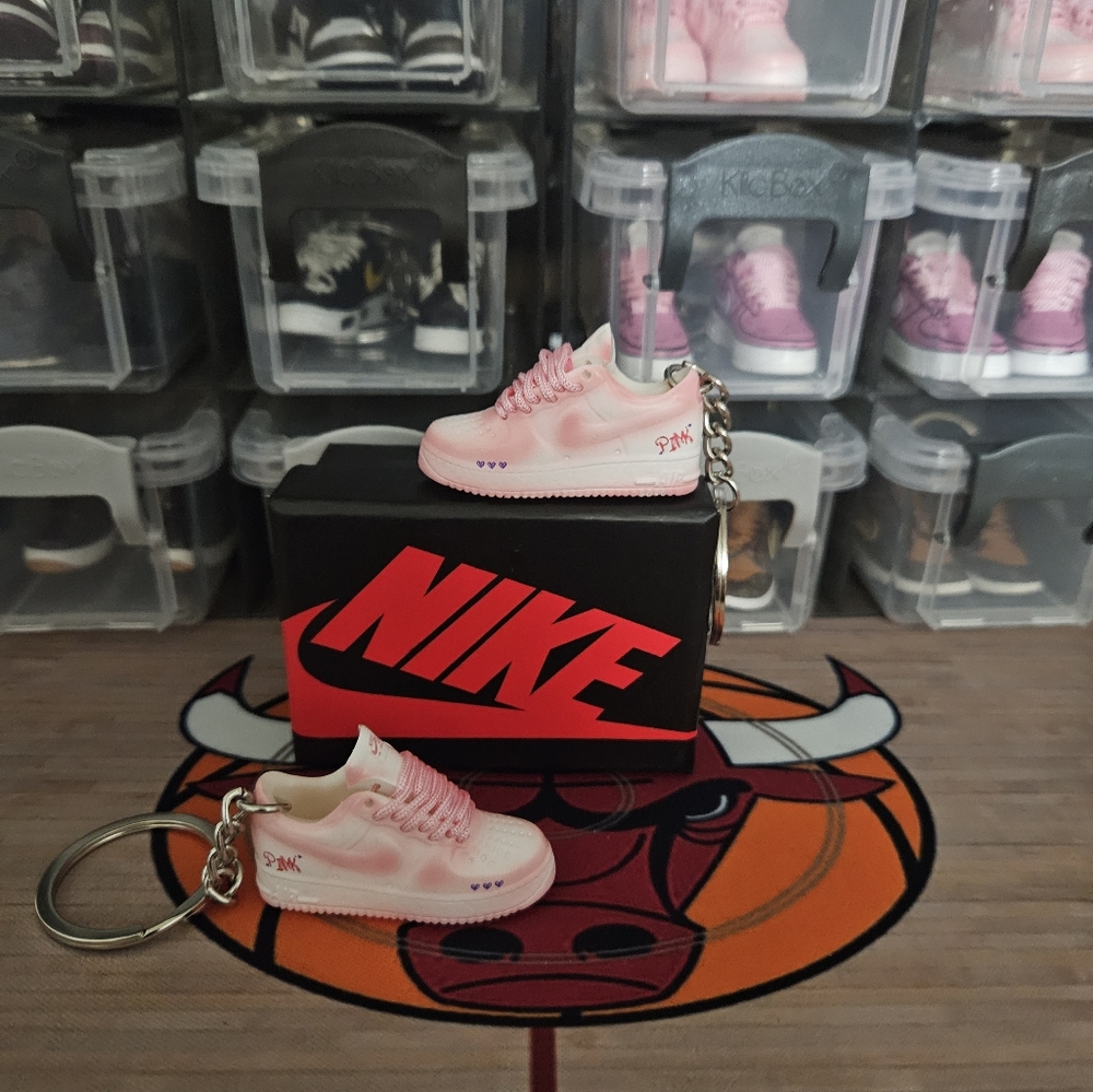 Nike Air Force 1 pair of mini sneaker keychain with Hot Wheels mini skate board.